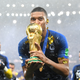 Kylian Mbappé of France celebrates with the World Cup Trophy following his sides victory in the 2018 FIFA World Cup Final between France and Croatia at Luzhniki Stadium on July 15, 2018 in Moscow, Russia.